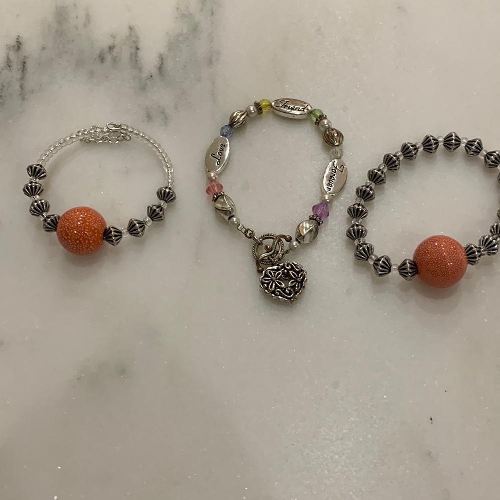 Love,Friend,Forever bracelet plus 2 with orange beads.One is stretch.